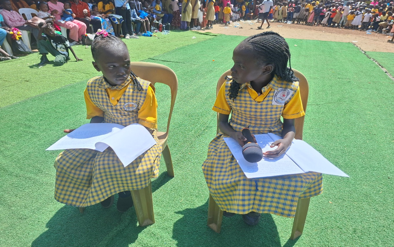 Young school journalists presenting at a school celebration